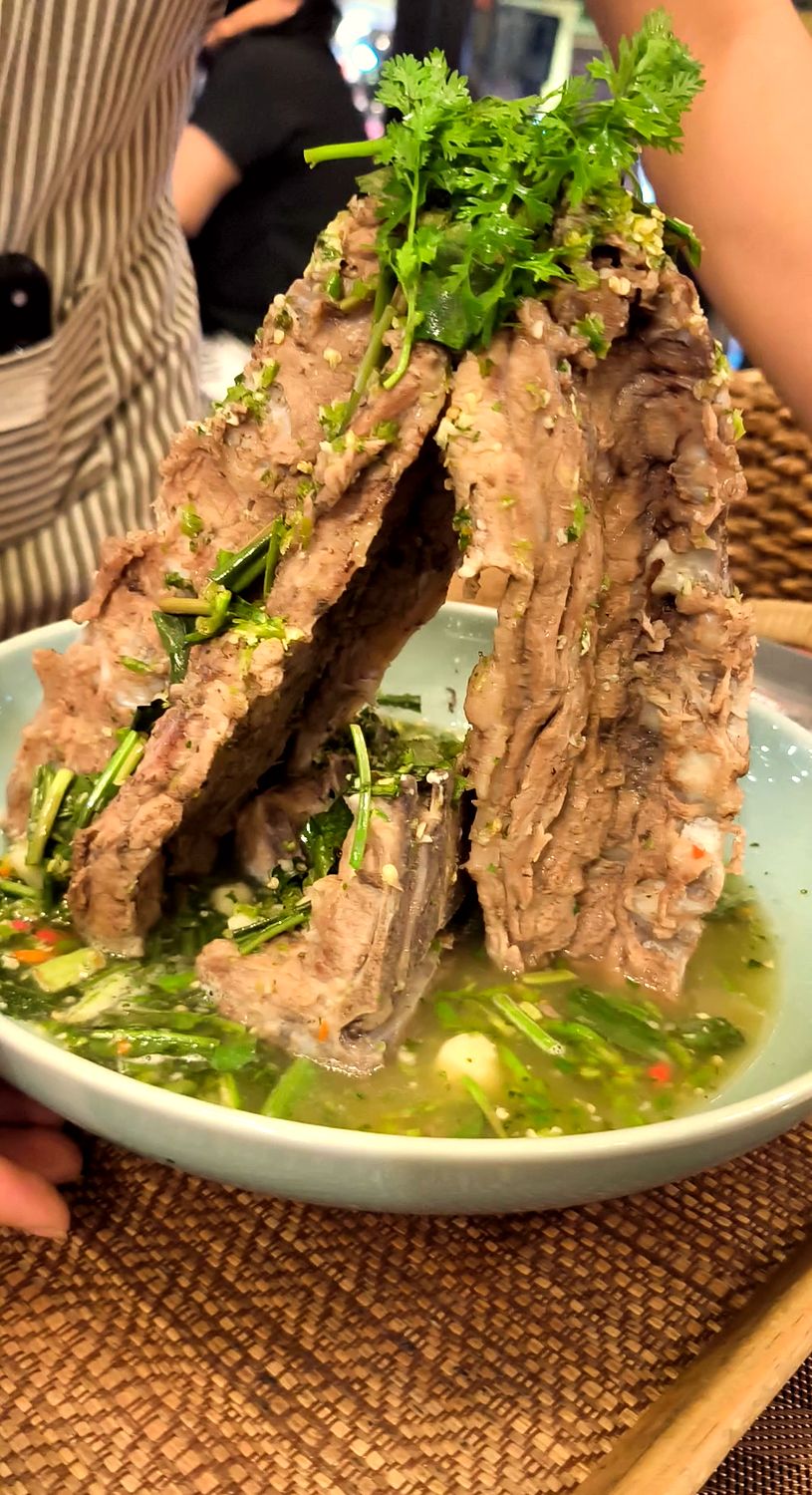 Volcano ribs: a tower of pork ribs in a spicy, sour broth with herbs